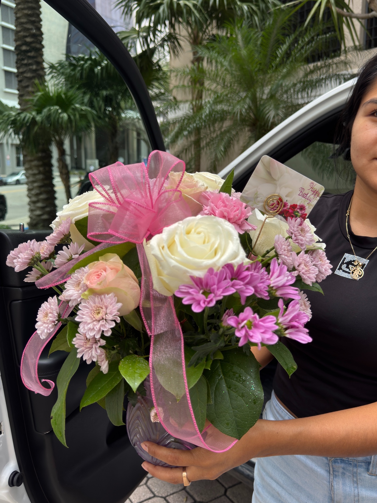 Pastel birthday arrangement delivered curbside in Miami